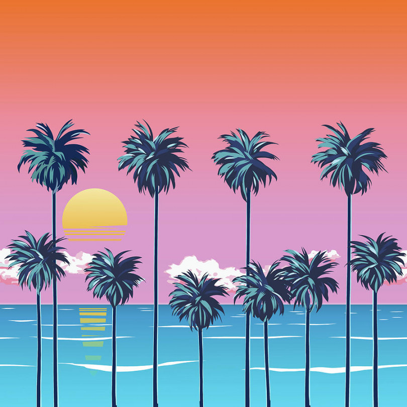 Sunset on the beach with palm trees, turquoise ocean and orange